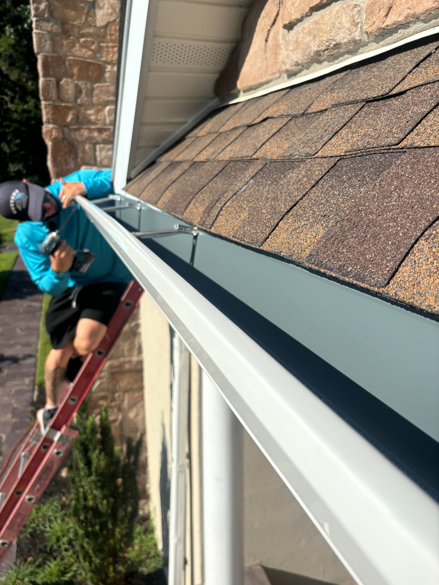 Gutter install on stone colonial